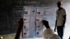 FILE - Election officials start counting the ballots after polls closed in the presidential elections in Bujumbura, Burundi, July 21, 2015. 