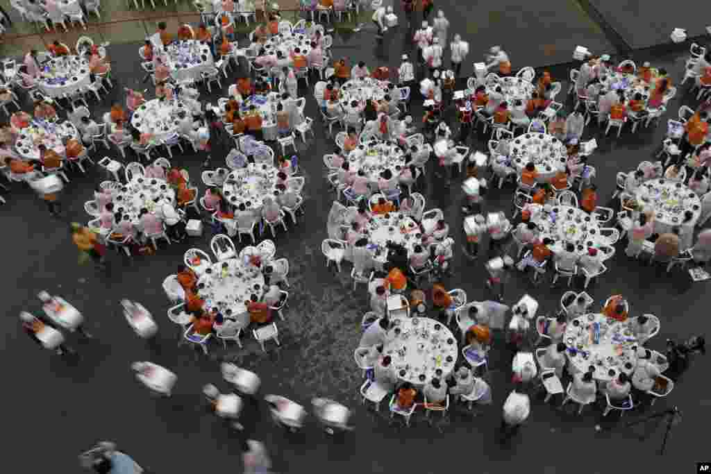 Chinese tourists taste Samgyetang, Korean traditional ginseng chicken soup, at a massive outdoor party in Seoul, South Korea.