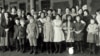 FILE - Immigrant children are part of this group photographed at Ellis Island in New York, about 1908.