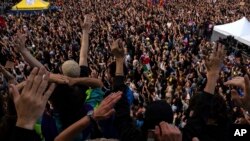People gather at Republique plaza in a protest against the far right on July 3, 2024, in Paris. France will deploy 30,000 police across the country late Sunday following parliamentary elections. The campaign has been marked by growing violence.