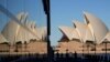 People walk around the waterfront of at Campbell Cove in Sydney, Australia, May 19, 2021. 