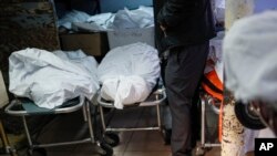 Pat Marmo, owner of Daniel J. Schaefer Funeral Home, walks through his body holding facility that is struggling to handle overflow of clients stemming from COVID-19 deaths, Thursday, April 2, 2020, in the Brooklyn borough of New York. "This is a…