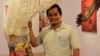Srey Bandaul, 46, one of the co-founders of art school Phare Ponleu Selpak, participates in an art exhibition and performance for the organization's 25th anniversary at the French Institute in Phnom Penh, April 5, 2019. (Phorn Bopha/VOA Khmer) 