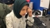 WHBF-TV Reporter Tahera Rahman works the phones to set up a potential news story.
