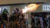Riot police fire tear gas during the anti-extradition bill protest in Hong Kong, Aug. 11, 2019. 