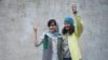 FILE - Iranian journalists Niloofar Hamedi, right, and Elaheh Mohammadi flash the victory sign after being released from prison on Jan. 14, 2024, in Tehran, having been released on bail pending an appeal. Iran's courts announced on Feb. 11, 2025, that the two have been pardoned.