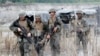 FILE - U.S. troops are seen on patrol during joint U.S.-Philippines military exercises in Tarlac province, north of Manila.