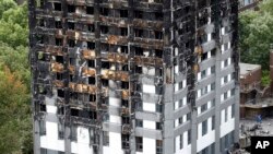 The burnt Grenfell Tower apartment building standing testament to the recent fire in London, June 23, 2017.
