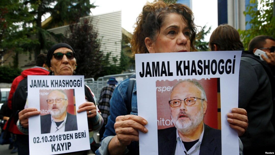Human rights activists hold pictures of Saudi journalist Jamal Khashoggi during a protest outside the Saudi Consulate in Istanbul, Turkey, Oct. 9, 2018.