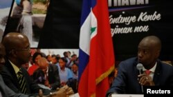 Prezidan ayisyen an Jovenel Moise pandan li tap pale ak premye minis nonmen an, Jean-Michel Lapin nan Palè Nasyonal, 21 mas 2019. 