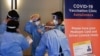 Medical staff work in the waiting area at a coronavirus disease (COVID-19) vaccination clinic at the Bankstown Sports Club as the city experiences an extended lockdown, in Sydney, Australia, Aug. 3, 2021. 