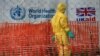 FILE - A person dressed in Ebola protective apparel is seen inside an Ebola care facility at the Bwera general hospital near the border with the Democratic Republic of Congo in Bwera, Uganda, June 14, 2019. 