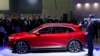 VinFast CEO Michael Lohscheller introduces the new VF e35 EV at the AutoMobility LA Auto Show, Nov. 17, 2021, in Los Angeles. 