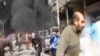 This image taken from video obtained from Ugarit News, which has been authenticated based on its contents and other AP reporting, shows smoke and fire after a fighter jet crashed into a suburb of Damascus, Syria, Feb. 20, 2013.