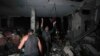 Palestinians search for survivors and bodies in the rubble of a mosque destroyed in an Israeli airstrike in Deir al-Balah, Oct. 6, 2024.