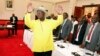 FILE - Ugandan President Yoweri Museveni gestures to delegates attending the Burundi peace talks at Entebbe State House, east of Kampala, Dec. 28, 2015.