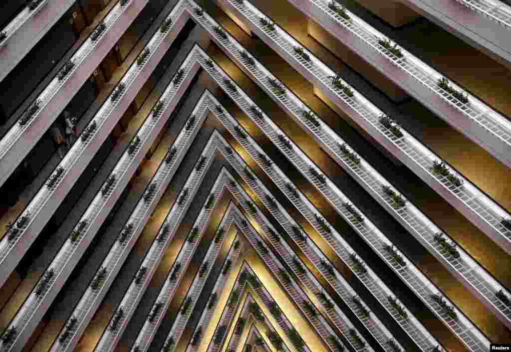 People walk in the corridor of the Pan Pacific Hotel in Singapore, Feb. 21, 2016.