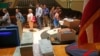 FILE - Ballots are stacked and ready as residents wait in line to vote in Milwaukee, June 5, 2012. 
