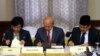 Government of the Philippines (GPH) chief negotiator Miriam Coronel Ferer (L) and Moro Islamic Liberation Front (MILF) chief negotiator Mohagher Iqbal (R) sign the peace agreement between both parties with AB Ghafar Tengku Mohamed as a witness from Malays