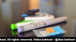 A blood sugare analyser and an insulin syringe are seen on a table, Nov. 13, 2019. (Photo: Diaa Bekheet)